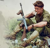 Australian soldier with thompson SMG WW2
