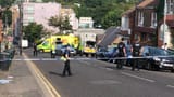 _107913244_policecarvtaxivpedestrianbearrdbrighton