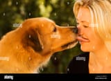 dog-kissing-blonde-woman-ARRXCE