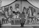 Hideki Tojo bows in front of a portrait of late Admiral Isoroku Yamamoto
