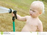 baby-spraying-garden-hose