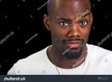 stock-photo-afro-american-man-with-intrigued-expression-wearing-a-white-t-shirt-17405536