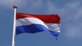 dutch-flag-in-blue-sky-waving-in-wind-the-national-flag-of-the-kingdom-of-the-netherlands-is-a-horizontal-tricolour-of-red-white-and-blue-is-the-oldest-tricolor-flag_vjj2uhfkg__F0000-1529850603