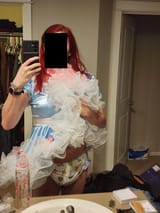 Showing off diaper in blue dress