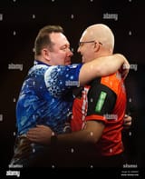 brendan-dolan-reacts-after-his-match-against-mickey-mansell-right-on-day-eight-of-the-paddy-power-world-darts-championship-at-alexandra-palace-london-picture-date-friday-december-22-[1]