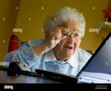 elderly-lady-amazed-by-her-computer-screen-senior-old-age-granny-finds-A5YY44