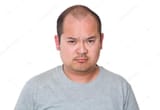 depositphotos_98728344-stock-photo-angry-asian-man-in-grey