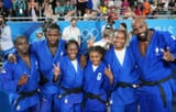 1444x920_l-r-athletes-of-team-france-joan-benjamin-gaba-maxime-gael-ngayap-hambou-clarisse-agbegnenou-sarah-leonie-cysique-romane-dicko-teddy-riner-celebrate-winning-the-gold-medals-after-competing-in-the-judo-mixed-team-final-against-team-japan-on-d