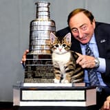 Gary Bettman presenting the Stanley Cup to a kitten (4)