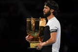 beijing-china-nikoloz-basilashvili-of-georgia-holds-the-winners-trophy-after-winning-the-mens