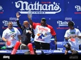 eric-badlands-booker-competes-in-a-lemonade-drinking-contest-during-the-2022-nathans-famous-international-hot-dog-eating-contest-at-coney-island-o-2JFNXAW