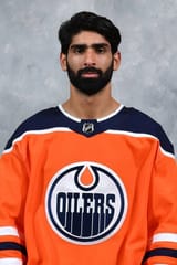 jujhar-khaira-of-the-edmonton-oilers-poses-for-his-official-headshot-for-the-2020-2021-season
