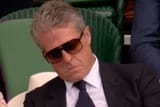 hugh-grant-sleeping-wimbledon-071025-eef4a74bf47a4d1b94f8dd8ac168b381