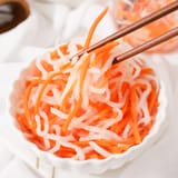 Vietnamese-pickled-carrot-and-daikon-with-chopsticks-thumbnail