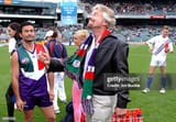 perth-captain-peter-bell-of-the-dockers-watches-on-as-sir-richard-branson-tosses-the-coin-prior-2789247526