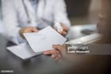 doctor-giving-patient-a-note[1]