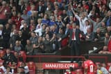 wenger stands old trafford