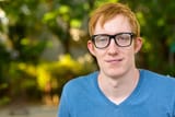face-nerd-man-with-red-hair-wearing-eyeglasses-park_251136-41870[1]