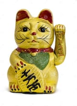 gilded-chinese-asian-feng-shui-lucky-charm-cat-paw-raised-greeting-denoting-wealth-prosperity-over-white-backgr-117451560