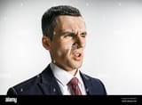 three-quarter-portrait-of-a-businessman-with-disgust-face-confident-professional-with-piercing-look-in-the-foreground-of-the-camera-MDCWN2