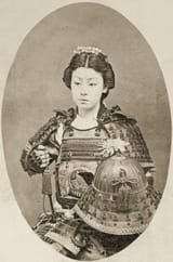 Japanese_School_-_Portrait_of_a_female_warrior_with_flowers_in_her_hair_c1895_-_(MeisterDrucke-520851)