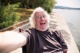 old-man-wheelchair-taking-selfie-his-phone-92138999