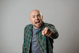 angry man pointing at screen