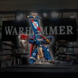 painted-version-of-capt-centos-space-marine-with-faded-out-warhammer-40k-store-in-background-fixed