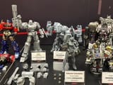 20-AMK-PRO-TFOne-Optimus-Prime-Megatron