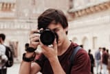 photographer-holding-a-nikon-camera