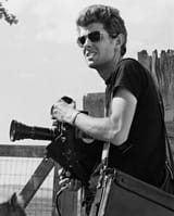 young-george-lucas-in-black-t-shirt-with-camera-photo-u1