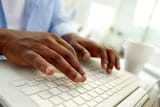 Brown hands typing