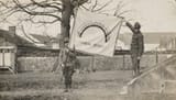 1920px-111-SC-6427_-_Unfurling_the_%22Rainbow_Division%22_flag_for_the_first_time_for_the_camera_-_NARA_-_55173762_%28cropped%29_%28cropped%29