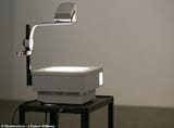 64106973-13787393-The_overhead_projector_pictured_which_used_simple_light_reflecti-a-72_1724837447451[1]