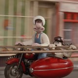 Wallace and Gromit rush to help Warwick tie his shoes