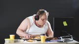 lazy-plump-man-t-shirt-headphones-wanders-web-people-like-computer-games-concept-addiction_186451-475