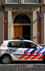 dutch-police-car-parked-outside-police-station-15985928