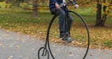 64627f8f2fa6d378e4cabf18_theiconicpennyfarthingbicyclesabriefhistory-2410666246