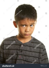 stock-photo-cute-filipino-boy-on-a-white-background-with-a-skeptical-expression-311126690