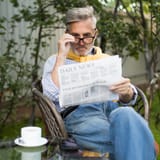 medium-shot-old-man-reading-newspaper_23-2148683746[1]