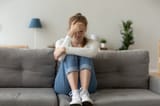 unhappy-female-sit-couch-feeling-sad-home-unhappy-female-sit-sofa-feeling-lonely-sad-upset-girl-crying-home-having-132432799