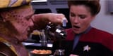 neelix-pouring-a-cup-of-gross-coffee-for-captain-janeway-in-the-mess-hall-on-star-trek-voyager