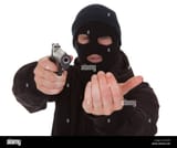 burglar-wearing-mask-aiming-gun-towards-camera-JCJDHG