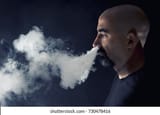 bald-man-vaping-studio-shot-260nw-730478416