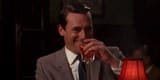 Don-Draper-laughing-and-having-a-drink-Cropped