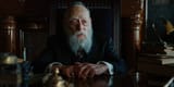 rabbi-marshak-alan-mandell-sitting-at-his-desk-in-a-serious-man-2
