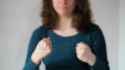 stock-footage-woman-showing-two-middle-fingers-with-her-hands-in-front-of-a-white-background-isolated-close-up_thumb.jpg