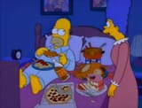 Homert eating in bed