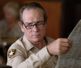 Ed_Tom_Bell_with_a_Newspaper