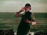 Anna_May_Wong_as_Lotus_Flower_calling_out_in_The_Toll_of_the_Sea